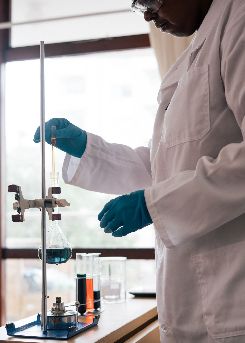 A laboratory scientist carefully examining a sample